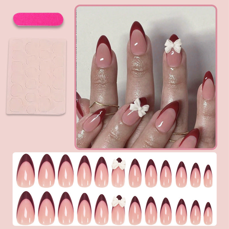 Kunstnagelset mit elegantem Spitzen-Design und romantischen Schleifen Brehn