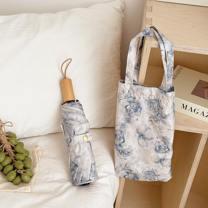 Damen Faltbarer Regenschirm mit floralen Motiven und Tragetasche Brehn