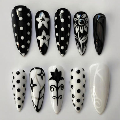 Kunstnagelset mit stilvollen grafischen Mustern Brehn