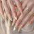 Kunstnagelset mit elegantem floralem Goldakzent Brehn