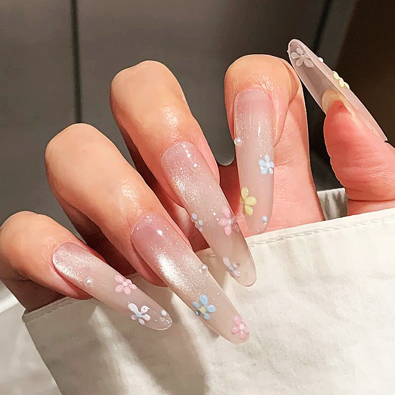 Lange Acryl Press-On Nägel mit floralen Verzierungen Brehn