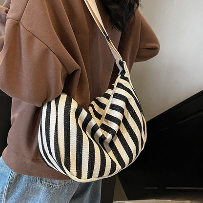Lässige gestreifte Schultertasche