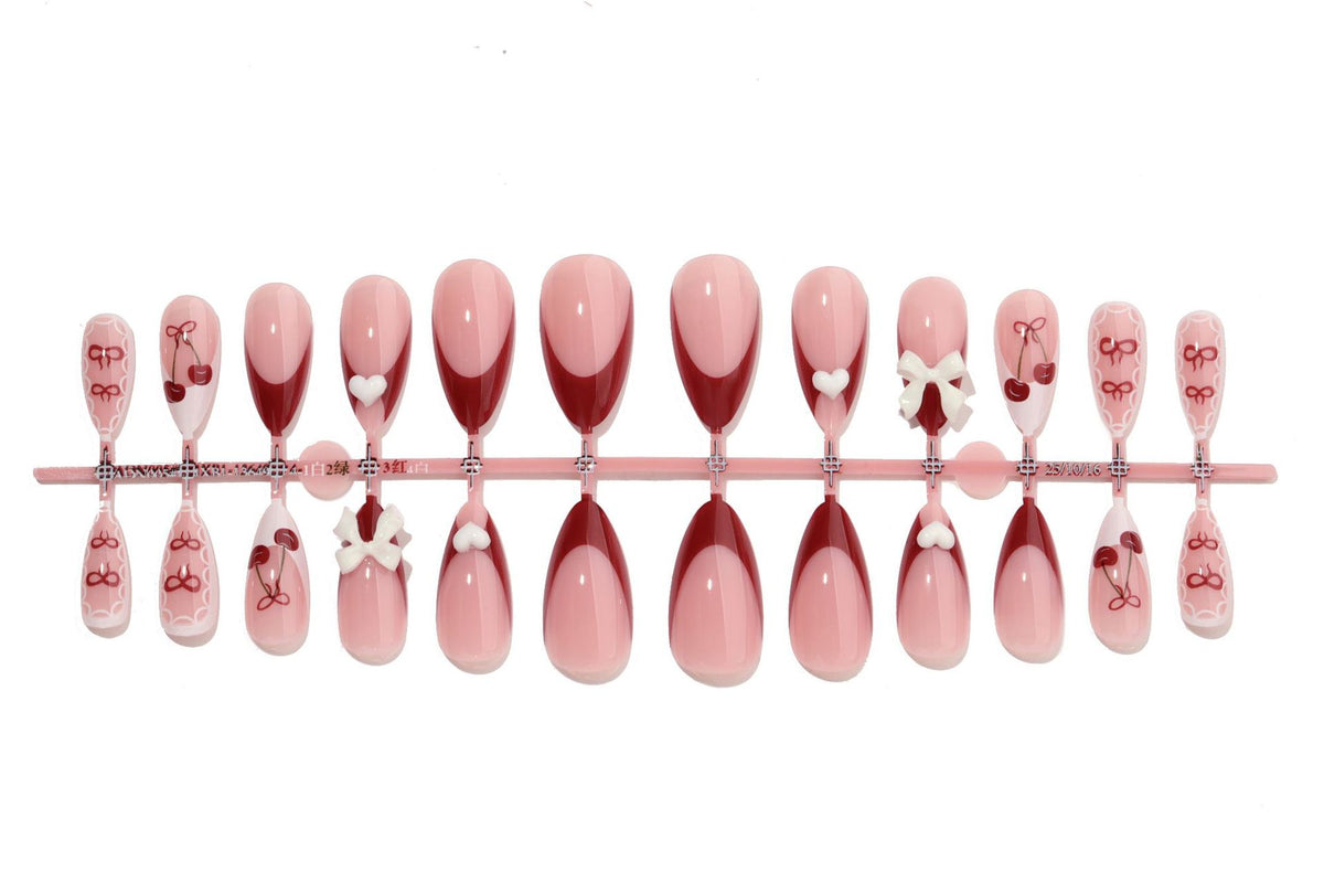 Dekorativer Druck-Nagel-Set mit charmanten Kirsch- und Schleifen-Designs Brehn
