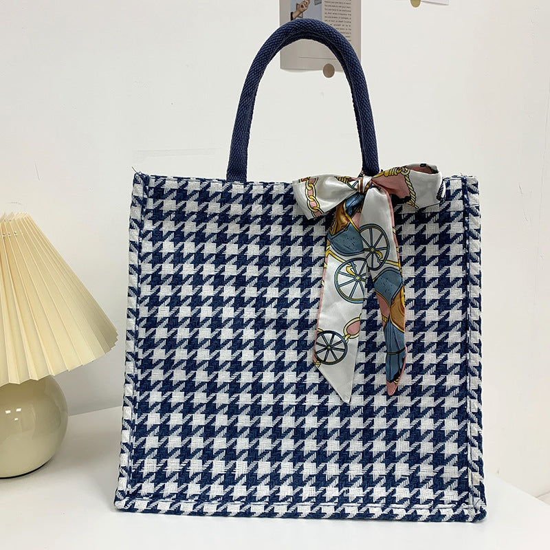 Elegante Houndstooth-Handtasche mit dekorativem Schleife
