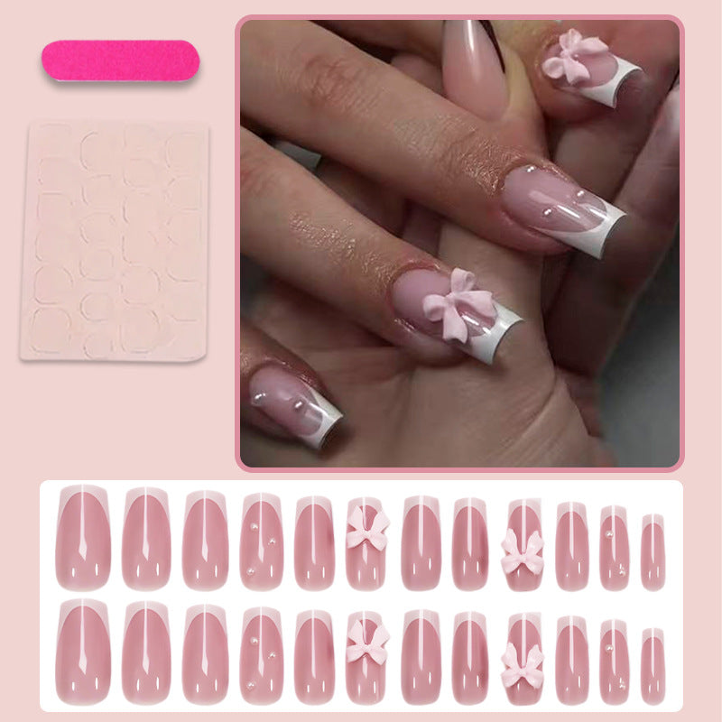 Kunstnagelset mit verspielten Schleifendesigns und eleganten Akzenten Brehn