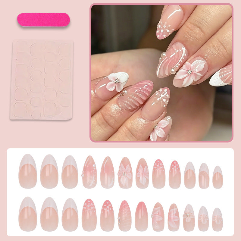 Kunstnagelset mit eleganten 3D-Blüten und verzierten Details Brehn