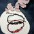 Adjustable Macrame Schutz Charm Armband Brehn