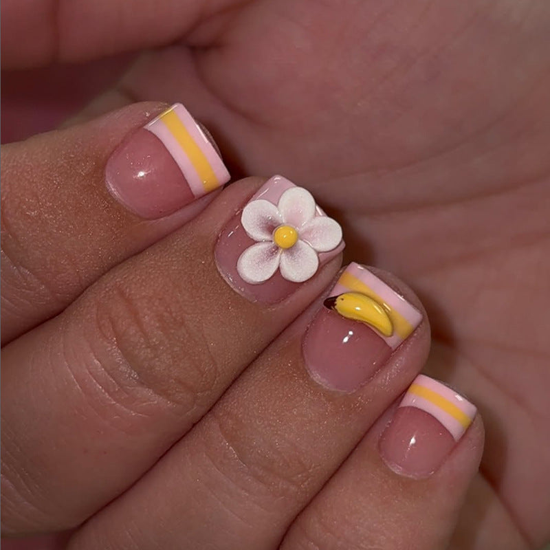 Kunstnagelset mit verspielten Blumen- und Fruchtmotiven Brehn
