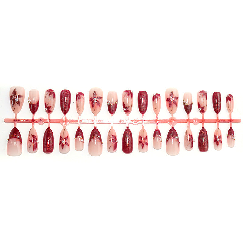 Elegantes Druck-On-Nagelset mit floralem und gem-ähnlichem Akzent Brehn