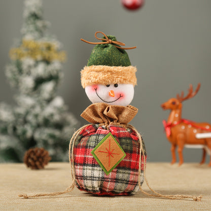 Niedlicher Weihnachtsgnom mit Geschenkesack Brehn