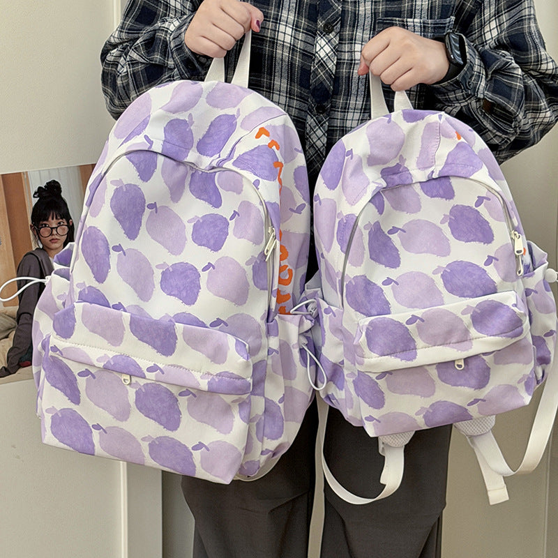 Verspielt gemusterter Rucksack mit Früchten