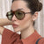 Damen stilvolle Sonnenbrille im aerodynamischen Design Brehn
