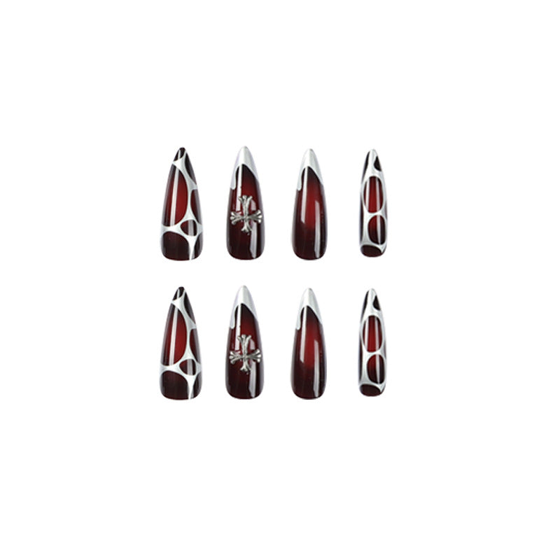 Kunstvolle Stiletto-Nägel mit eleganter Kreuzverzierung Brehn