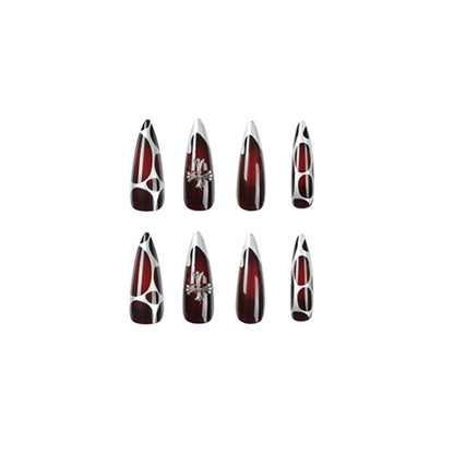 Kunstvolle Stiletto-Nägel mit eleganter Kreuzverzierung Brehn