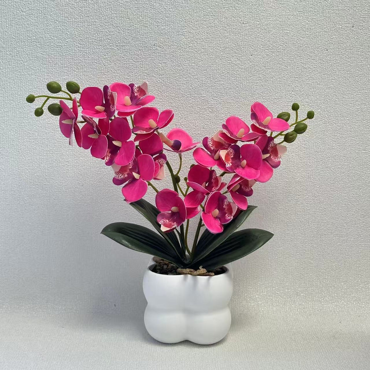 Lebensechte Orchideen Tischmittelstück
