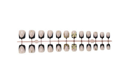 Kunstnagelset mit eleganten Schwarzspitzen und glitzernden Akzenten Brehn