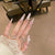 Dekoratives Stiletto Press-On Nagelkunst-Set mit elegantem Blumenmuster Brehn
