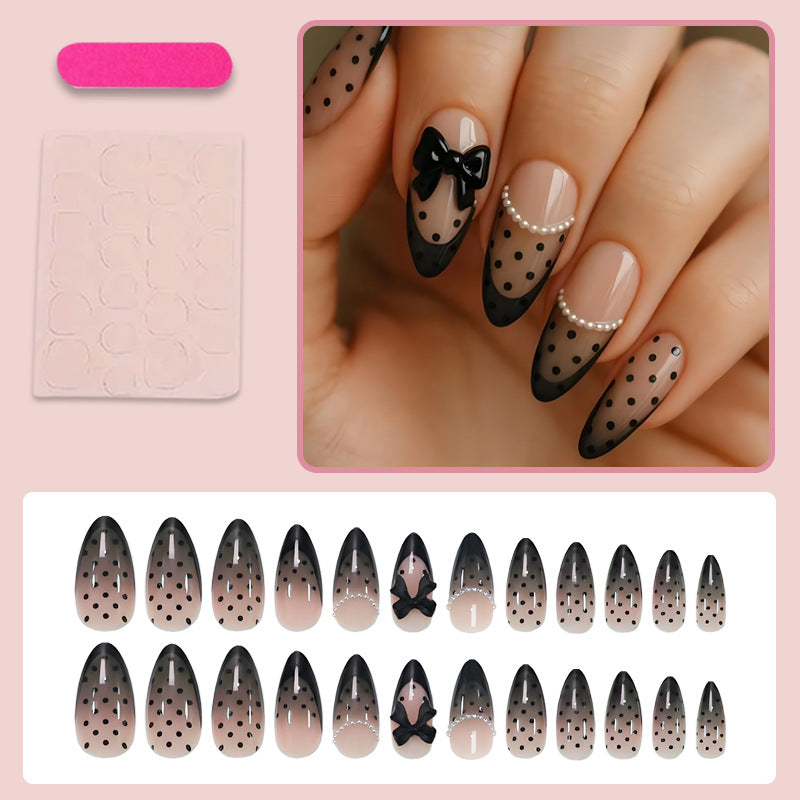 Kunstnagelset mit elegantem Punkt- und Schleifenmuster Brehn