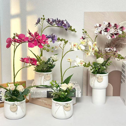 Lebensechte Orchideen- und Rosenblumenarrangement