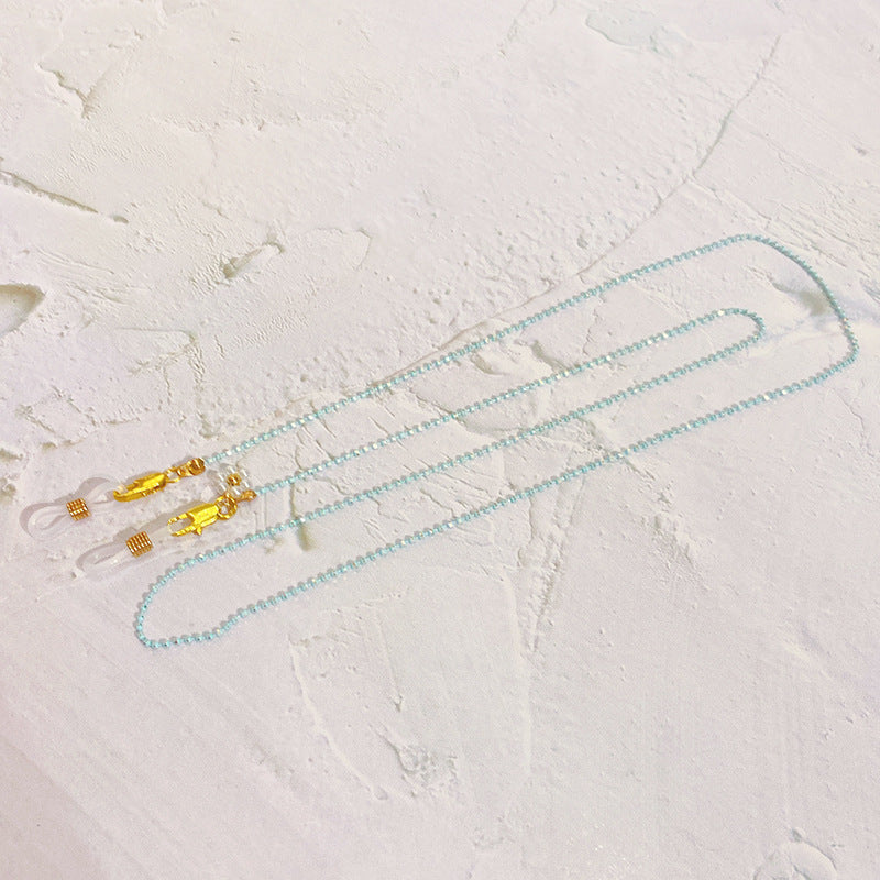 Kettenbrillenband mit Perlen und Goldanhängern Brehn