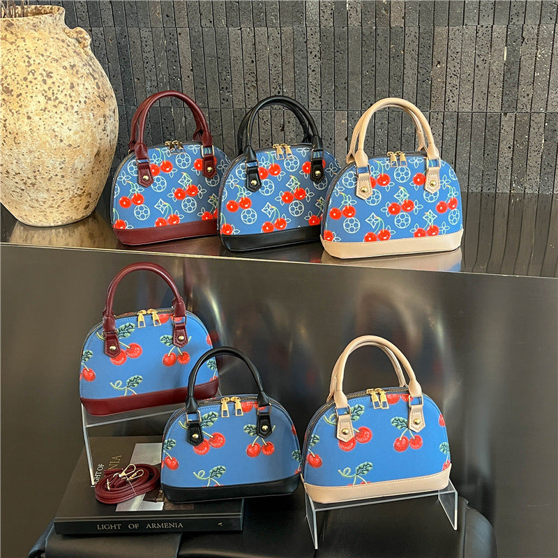 WoBestickte Kirschmuster-Handtasche Brehn