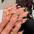 Künstlerische Stiletto-Nagelerweiterungen mit abstraktem Design Brehn