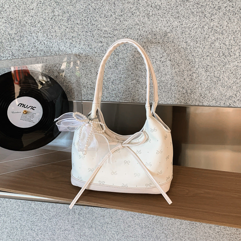 Schleifenverzierter Handtasche