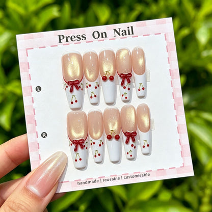 Künstlerisches Press-On Nagelset mit Kirsch- und Schleifenmotiven