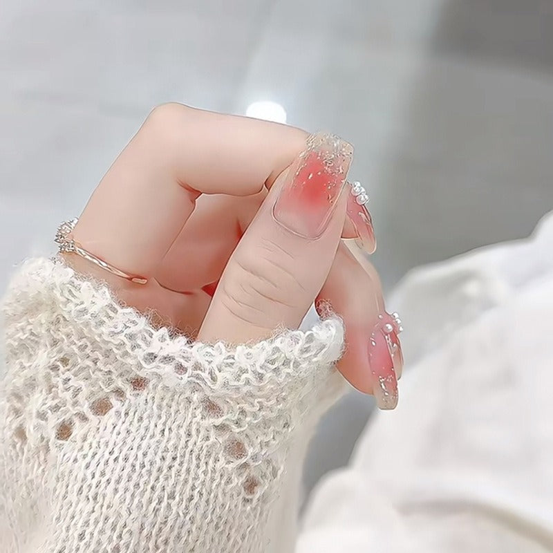 Kunstnagelset mit floralen Designs und Glitzerakzenten Brehn