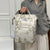 Blumenmuster Multi-Funktions-Wickelrucksack Brehn
