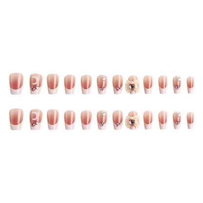 Kunstnagelset mit eleganten Blütenverzierungen und Glitzerakzenten Brehn