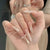 Eleganter Stiletto Press-On-Nagelset mit dekorativen Akzenten Brehn
