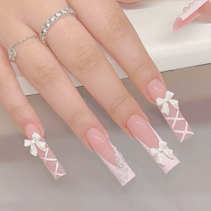 Kunstnagelset mit eleganten 3D- Schleifen und Perlenverzierungen Brehn