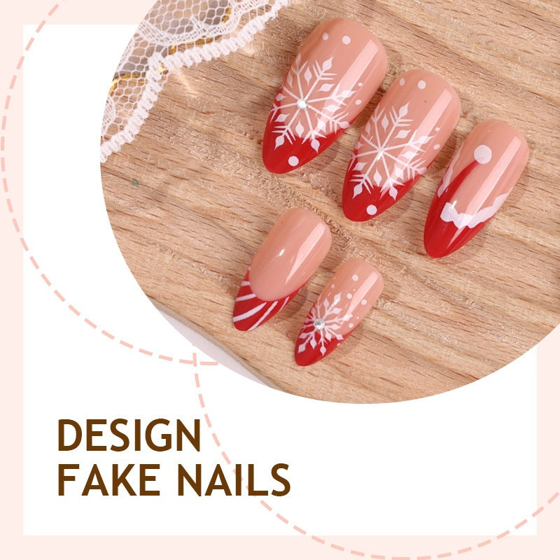 Kunstnagelset mit festlichen Wintermotiven und eleganten Akzenten Brehn