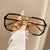 Damen geometrische Sonnenbrille mit besonderem Rahmen und UV-Schutz Brehn
