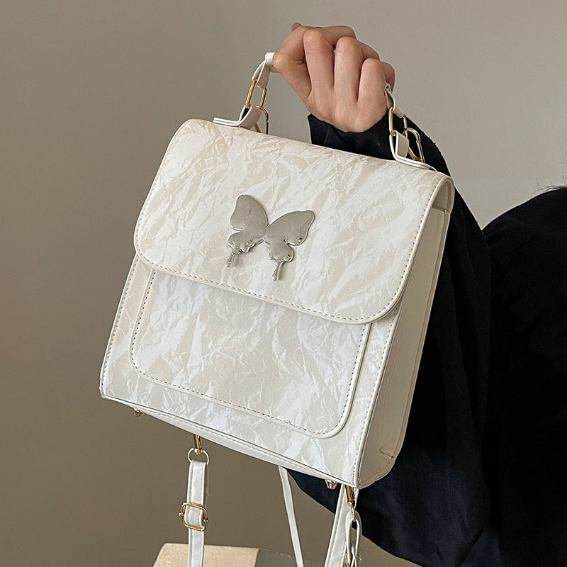 Schmetterlingsverzierte Handtasche