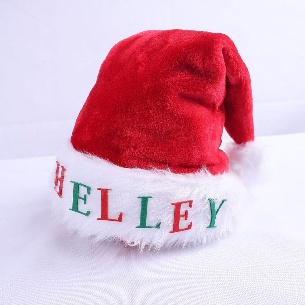 Weihnachtsmütze mit Lichtern und Applikationen