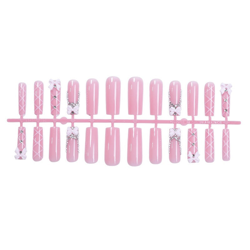 Kunstnagelset mit eleganten Schleifen- und Glitzerakzenten Brehn