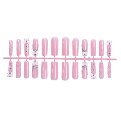 Kunstnagelset mit eleganten Schleifen- und Glitzerakzenten Brehn