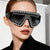 Damen Fashion-Sonnenbrille mit luxuriösem Kettenrahmen und schimmernden Akzenten Brehn