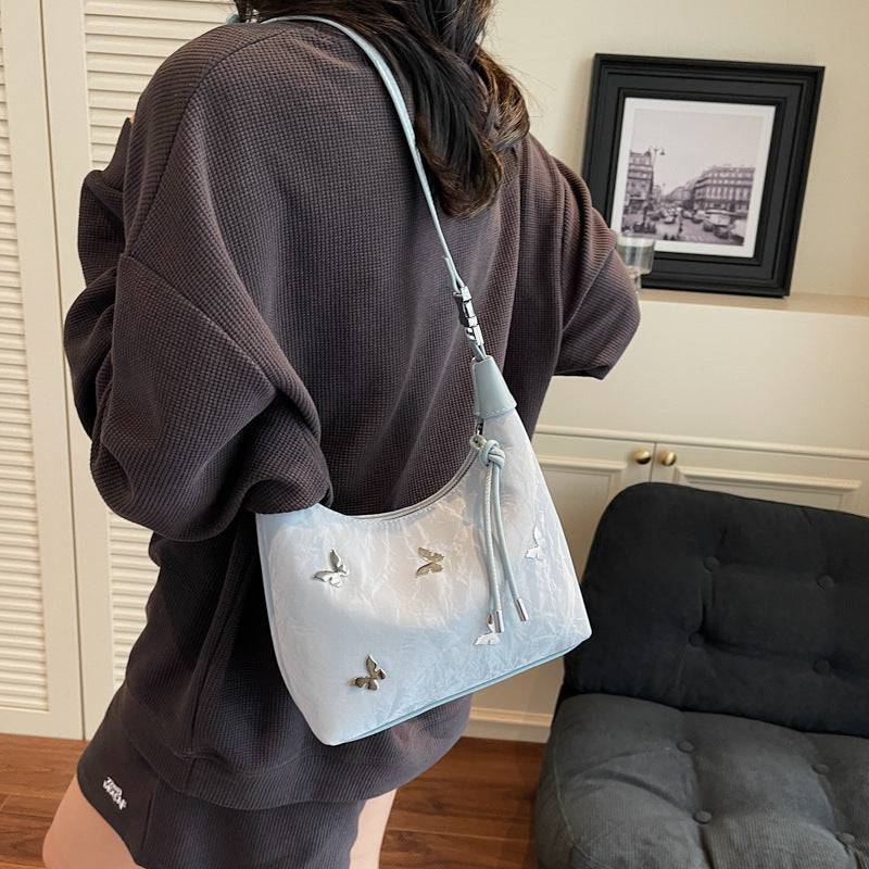 Stylische Handtasche mit Schmetterlingsdetail Brehn
