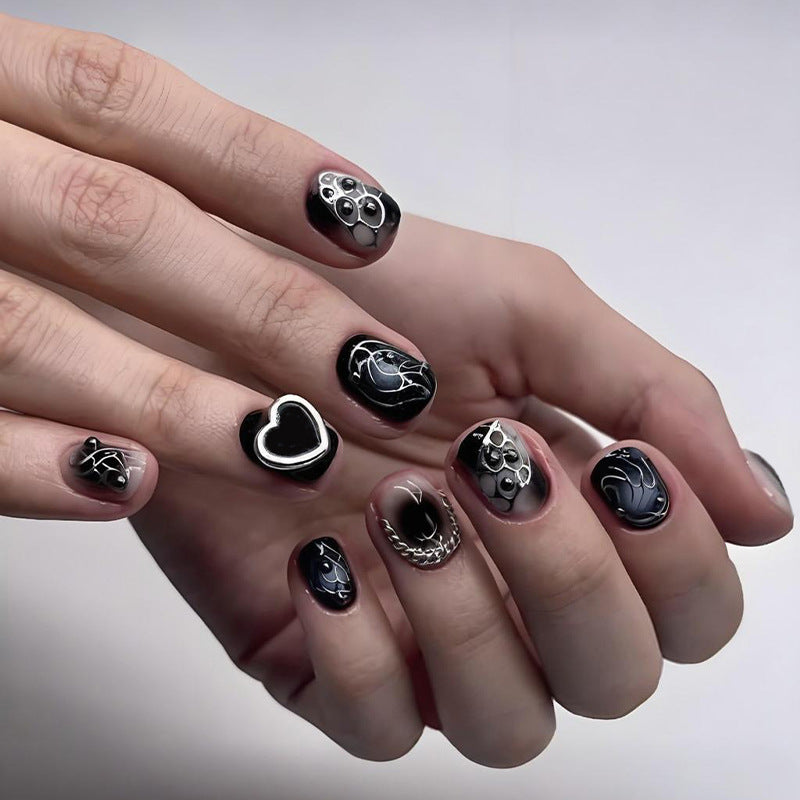 Kunstnagelset mit kreativen Schwarz-Weiß-Mustern Brehn
