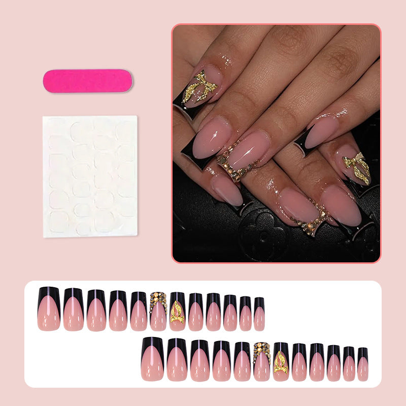 Kunstnagelset mit eleganter Goldverzierung und stilvollem Schwarz Brehn