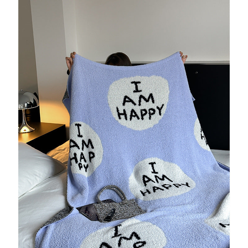Kuscheldecke mit großem Schriftmotiv und weichem Bouclégewebe