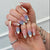 Künstlerisches Press-On-Nagelset mit floralem und Punktedesign Brehn
