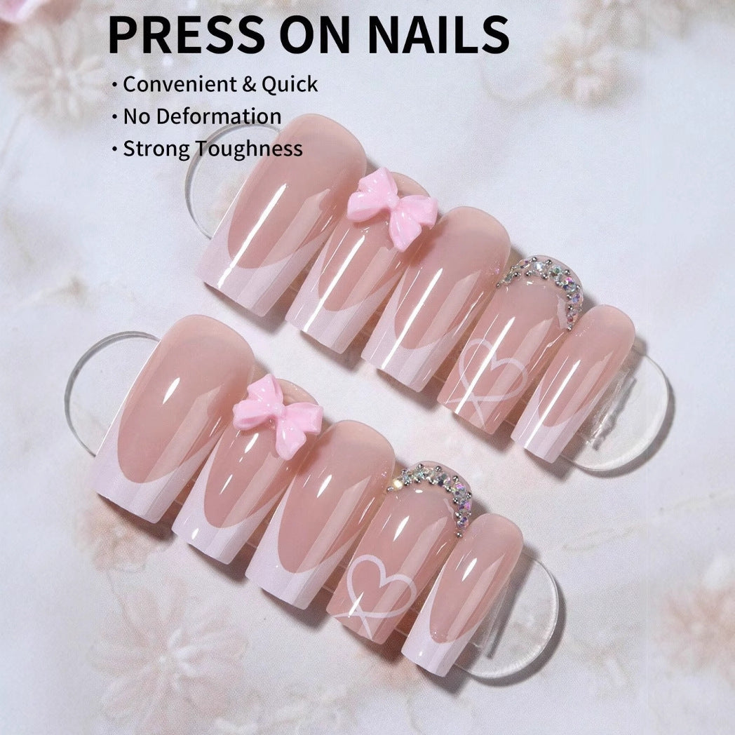 Kunstnagelset mit eleganten Schleifen- und Glitzerverzierungen Brehn