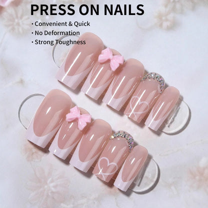 Kunstnagelset mit eleganten Schleifen- und Glitzerverzierungen Brehn