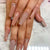 Glamouröse Kunstnagelverlängerungen mit Strass- und Glitzerdetails Brehn