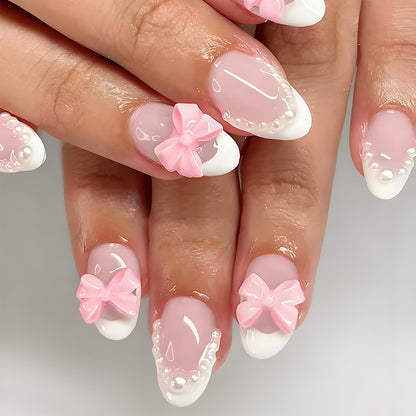 Kunstnagelset mit eleganten Schleifen- und Perlenverzierungen Brehn