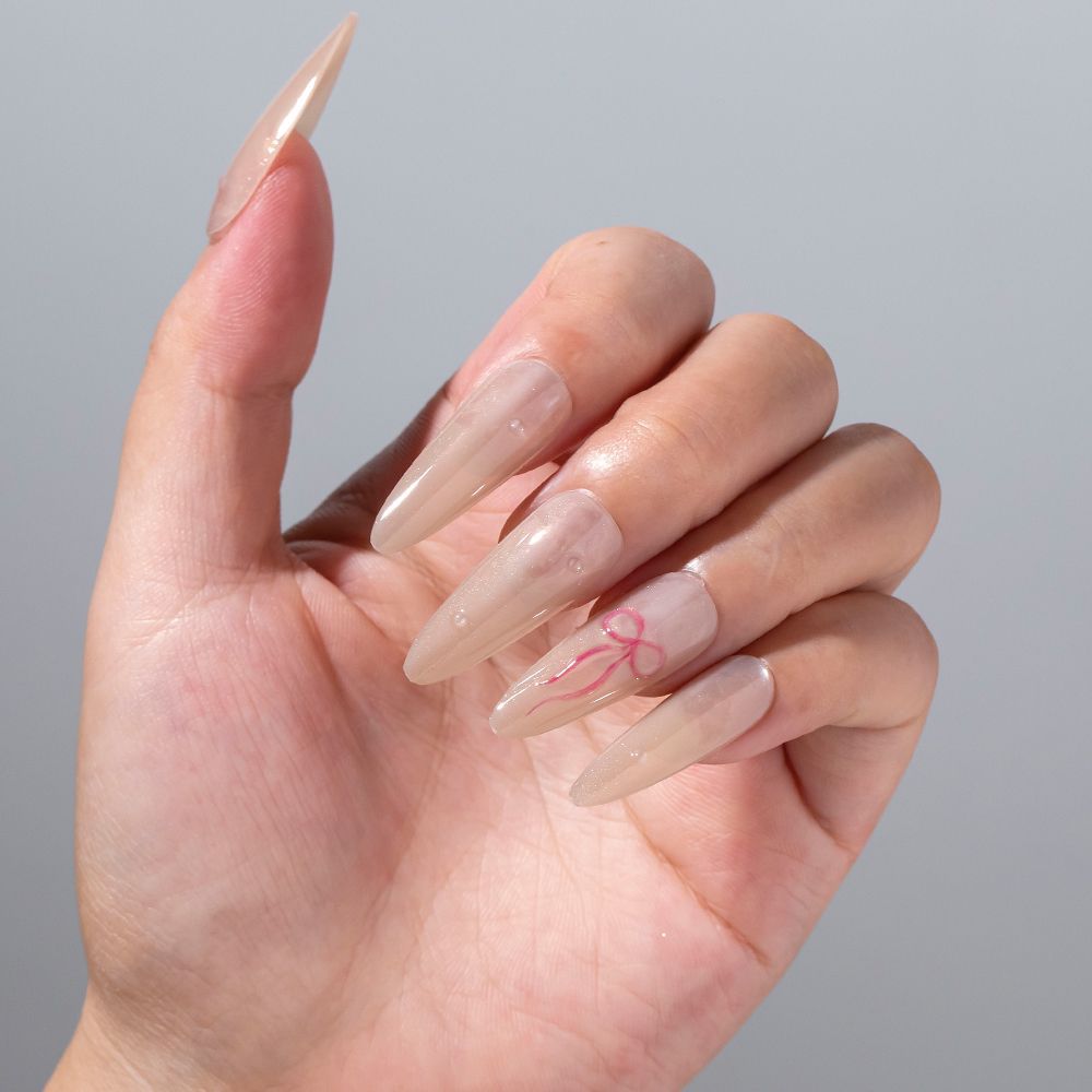 Elegantes Stiletto Press-On Nagelset mit Schleifenakzenten Brehn